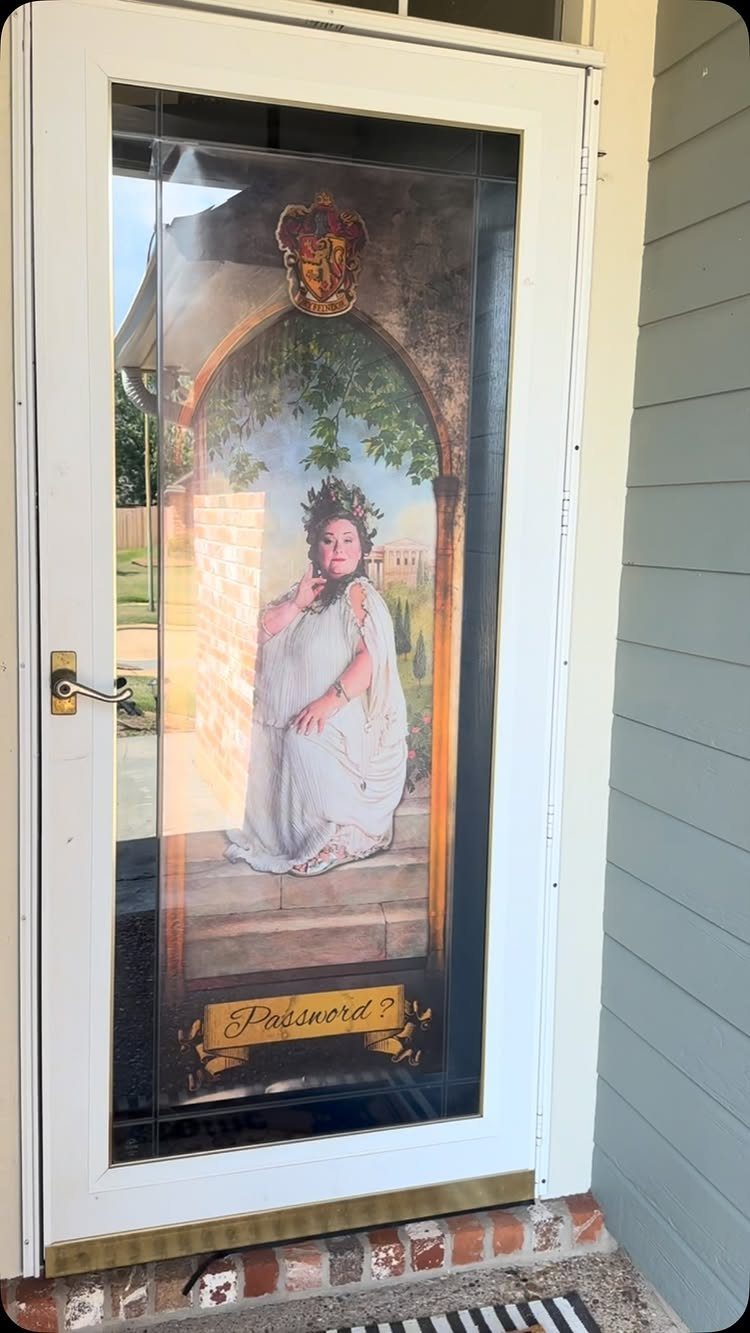 A glass door decorated with a large arched decal featuring a woman and the word Password.