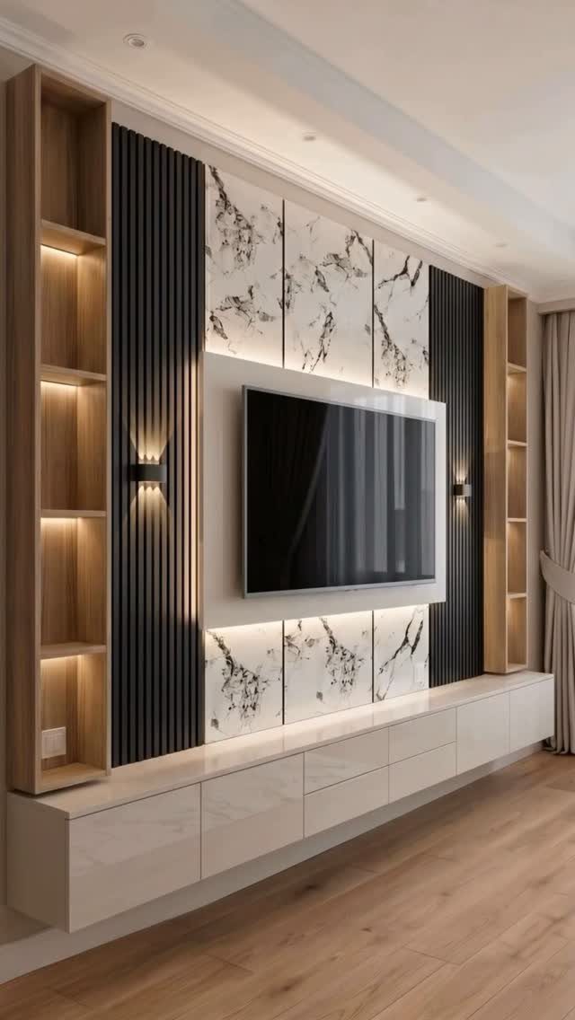 A modern media wall with white marble panels, black slats, and wooden shelving units.